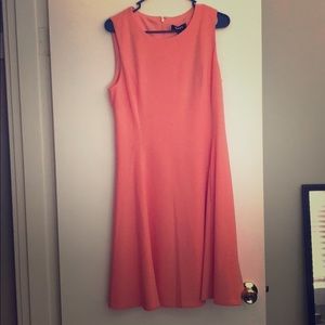 Coral colored cocktail dress.
